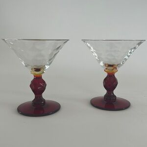 Pair of red stemmed vintage martini style stems.